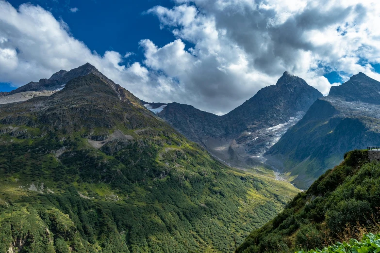 mountains and trees with sky above them