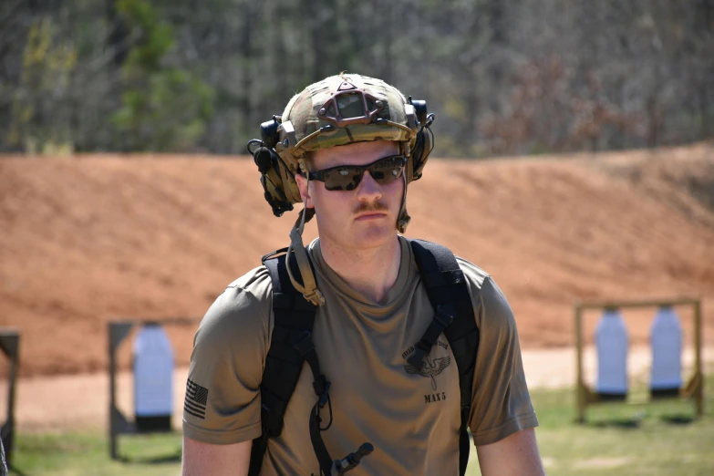 a man with a mustache in sunglasses wearing glasses