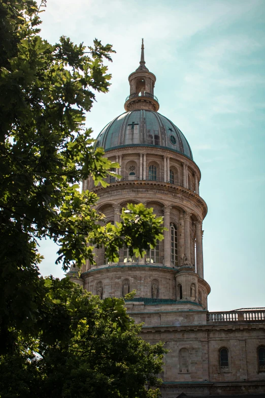 a dome sits on top of a building with windows