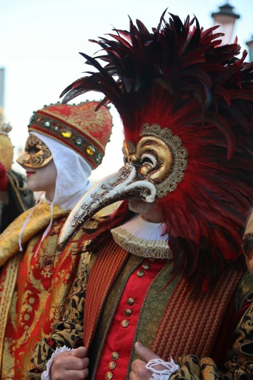 a group of people dressed in elaborate clothing