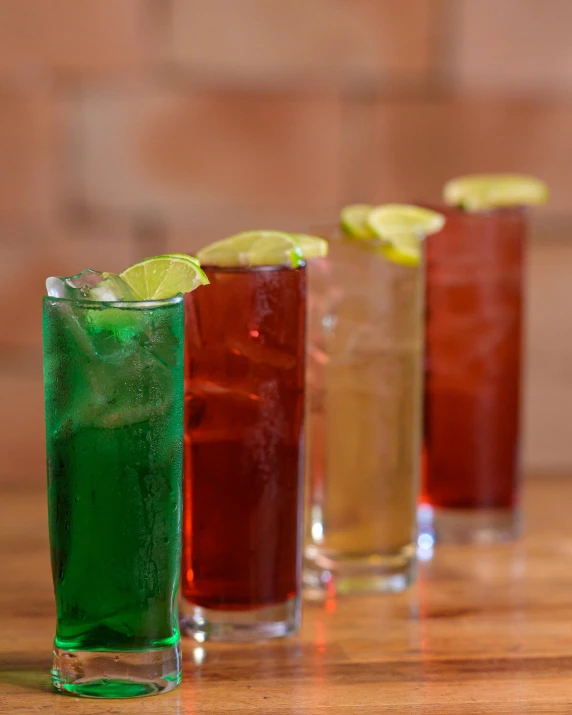 five different kinds of alcohol in glass on wooden table