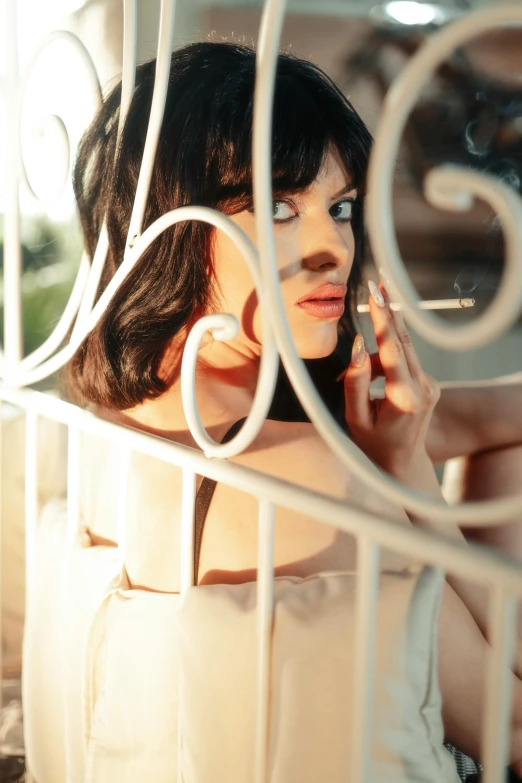 a woman that is leaning against a wall