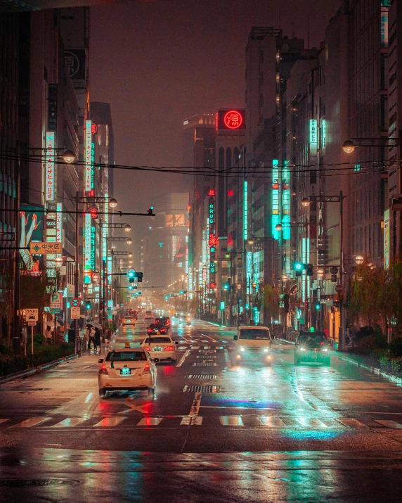 a city street at night with neon lights and traffic