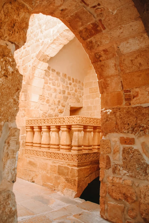 a building in the middle of stone pillars