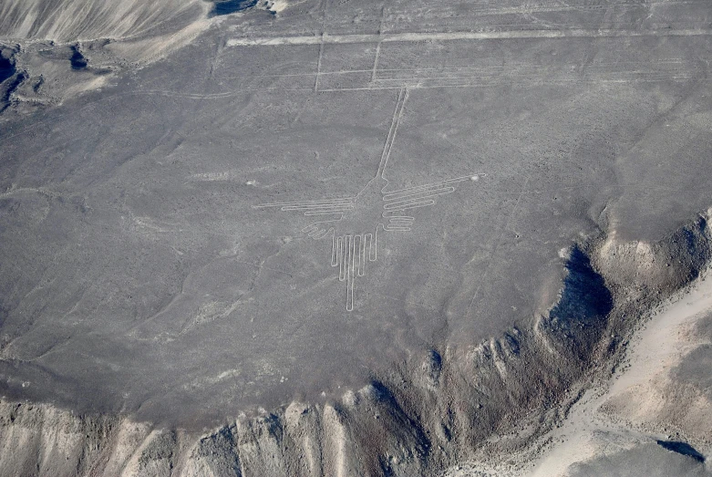 two people are painted on a mountain near desert