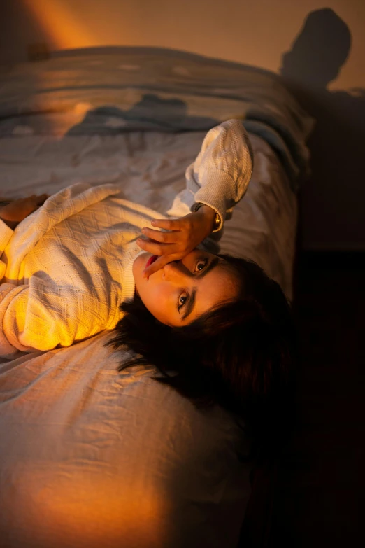 an image of a woman laying on a bed