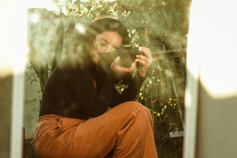 a man takes a selfie in his backyard mirror