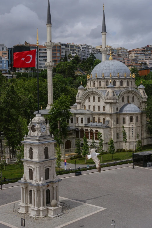 there are two white buildings with spires