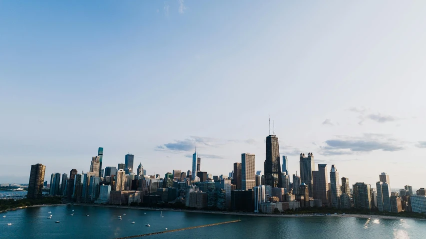 a view of an urban city as it sits near the water