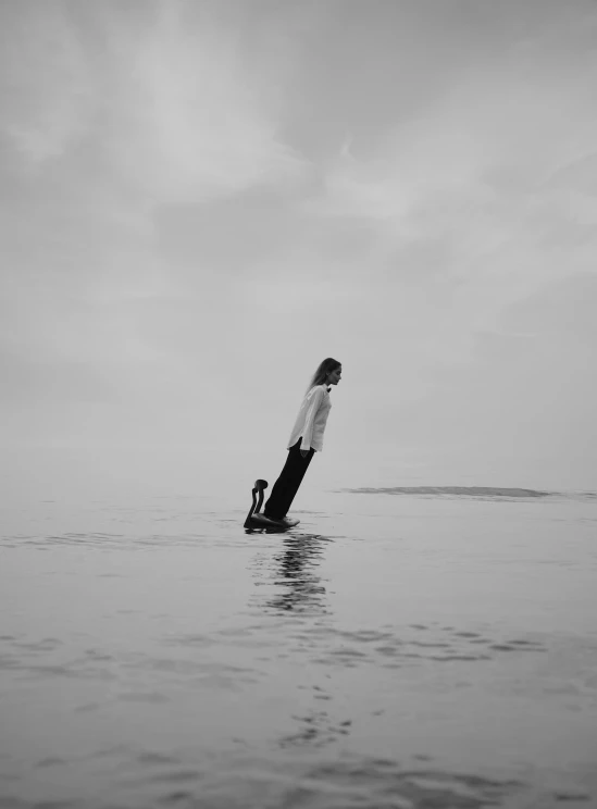 a person riding on top of a surfboard in the water