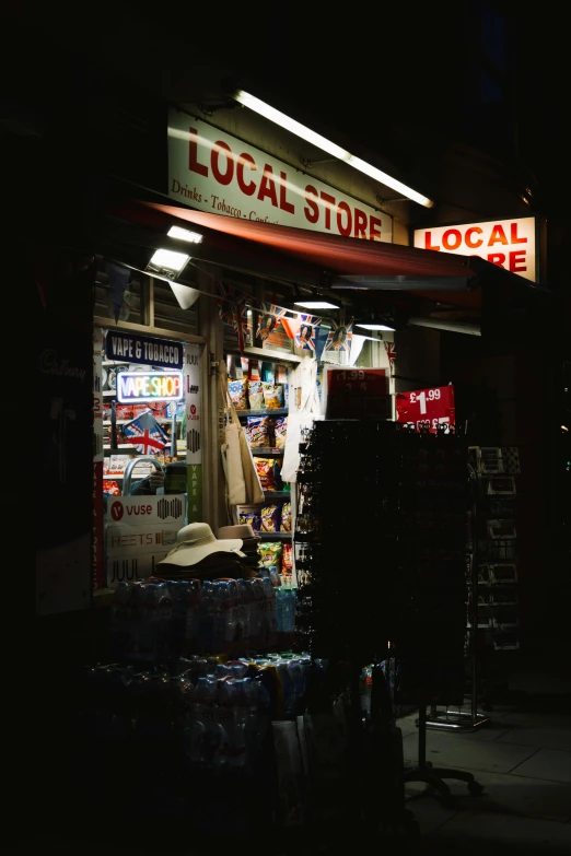 there is a lit up store front on a street