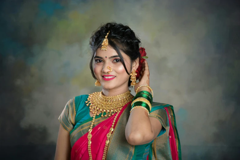 a woman wearing a red, blue and green sari