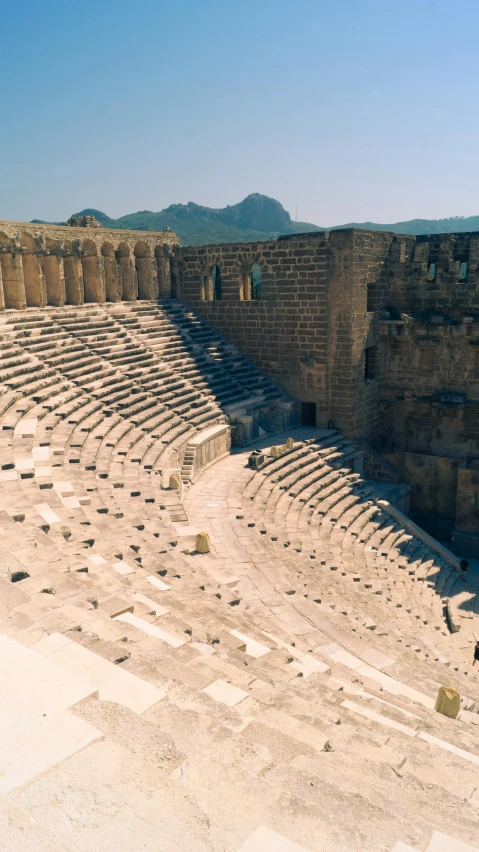 a set of seats in an outdoor roman stadium