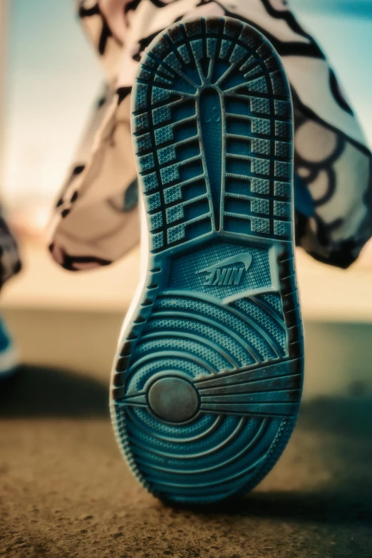 close up view of shoes and an umbrella on the ground