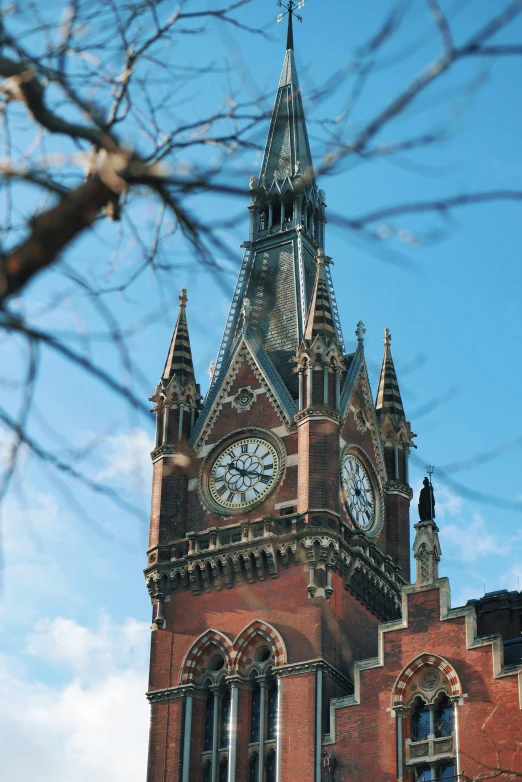 the building with the steeple has a clock displayed on it