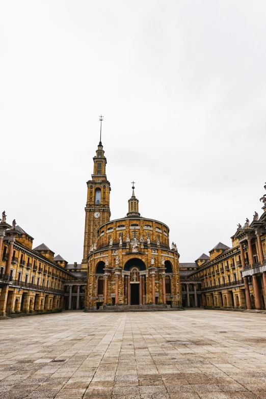 an ornate building with several towers and a massive circle