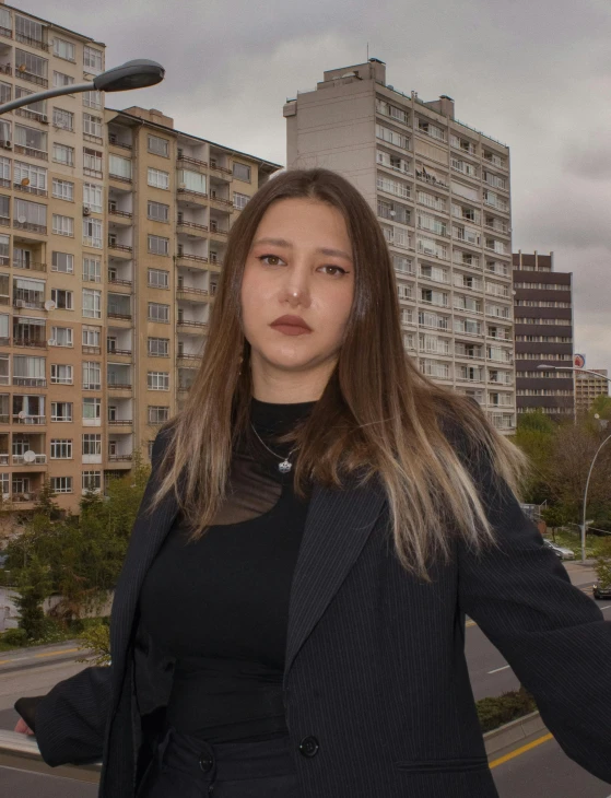 a woman standing next to a street light