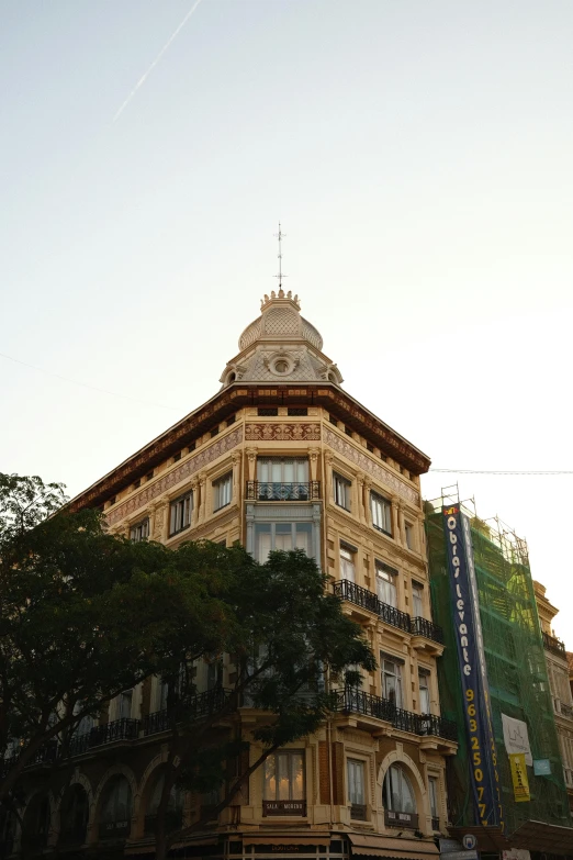 a tall building with windows and balconies on it