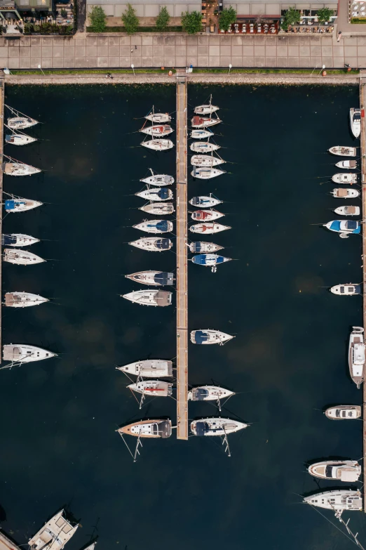 an overhead view of some boats docked at pier