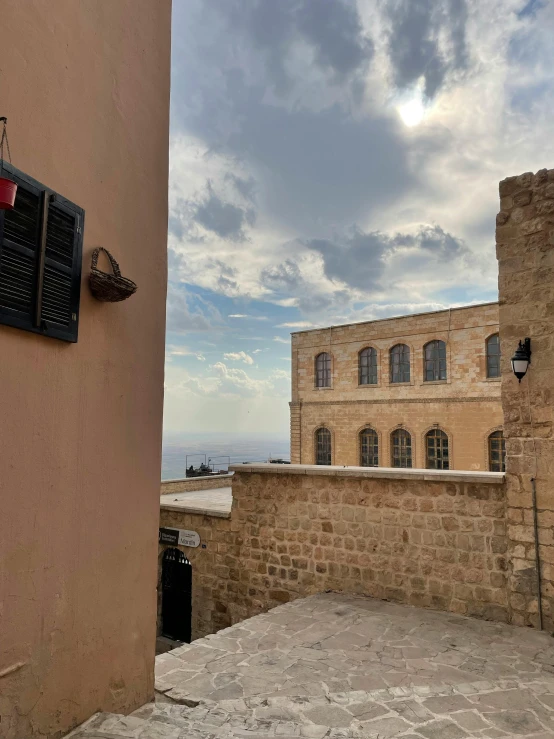 a stone building with a sky background