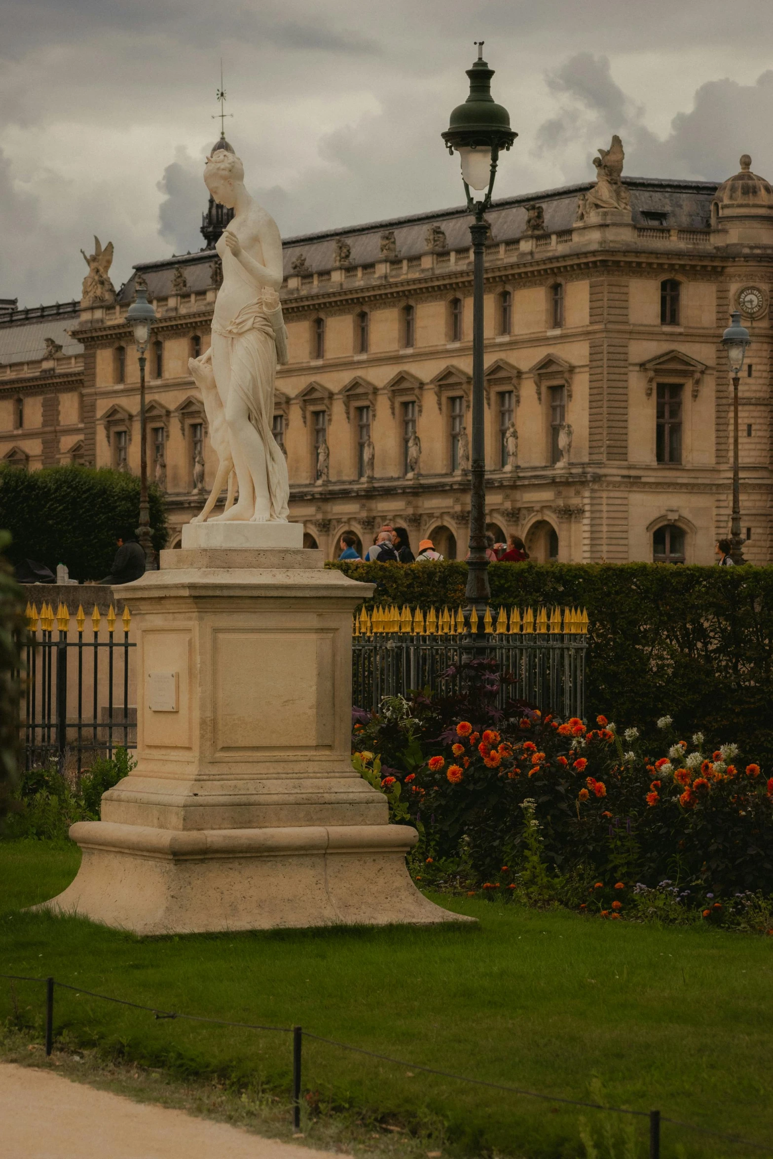 a statue in front of a large building