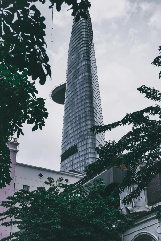 there is a large glass building that looks like it's in the sky