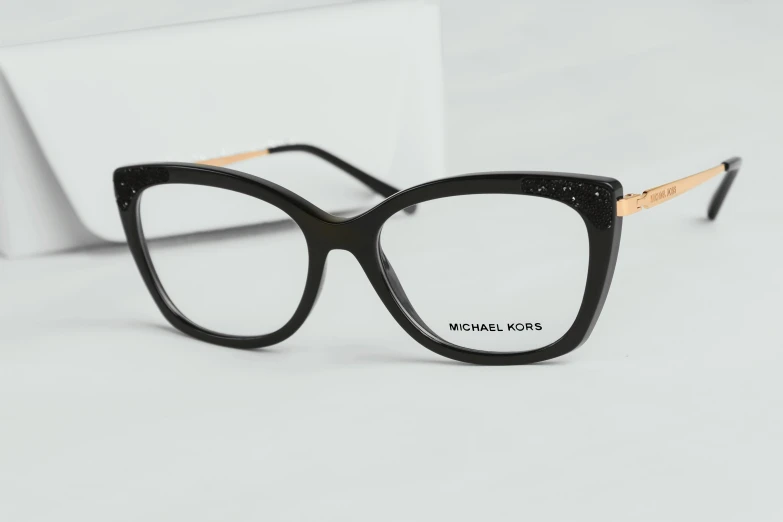 the classic eye glasses are made in a black and gold pattern