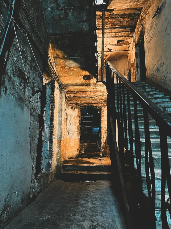 a stairway inside of a dirty building with some stairs