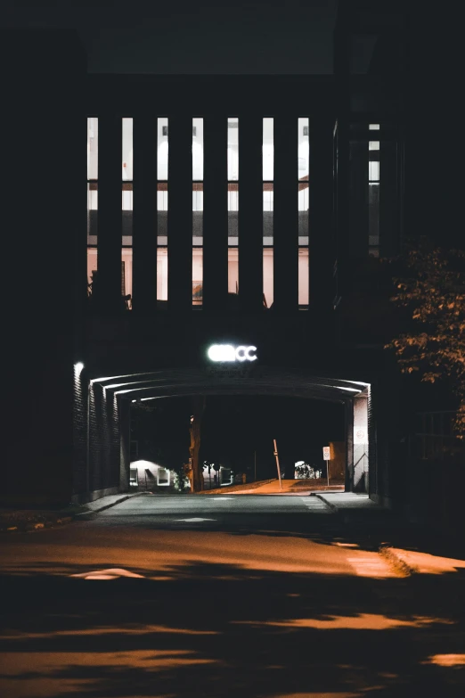 an empty parking garage on a city street at night