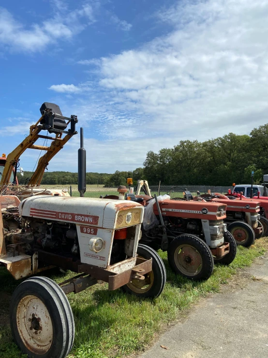 an antique farm equipment line up for auction