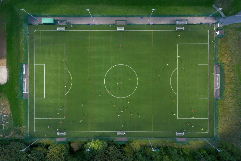 a soccer field in an open field with a small group of people