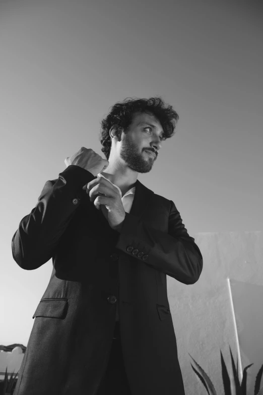 black and white pograph of a man in jacket