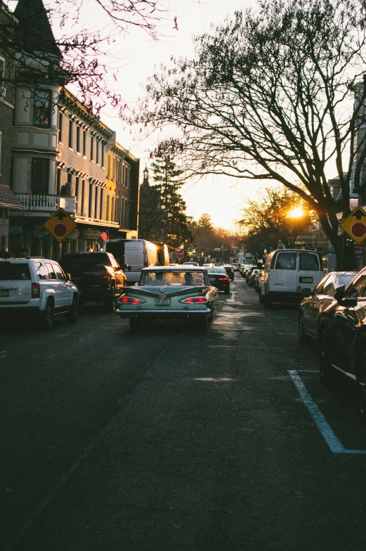 cars are parked at the intersection on the street