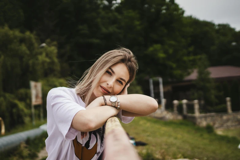 woman sitting on bench with hand resting on shoulder