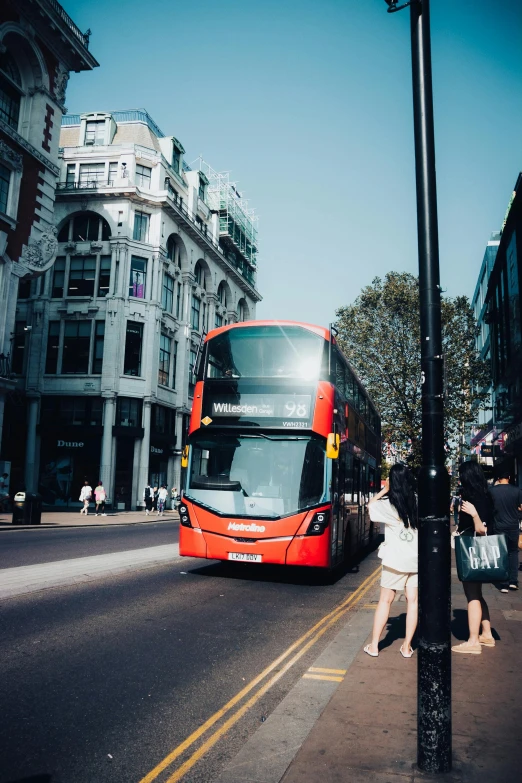 there is a bus that is going down the street