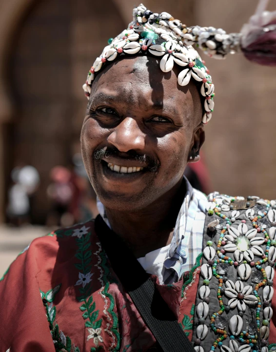 a man with some hair accessories on his head