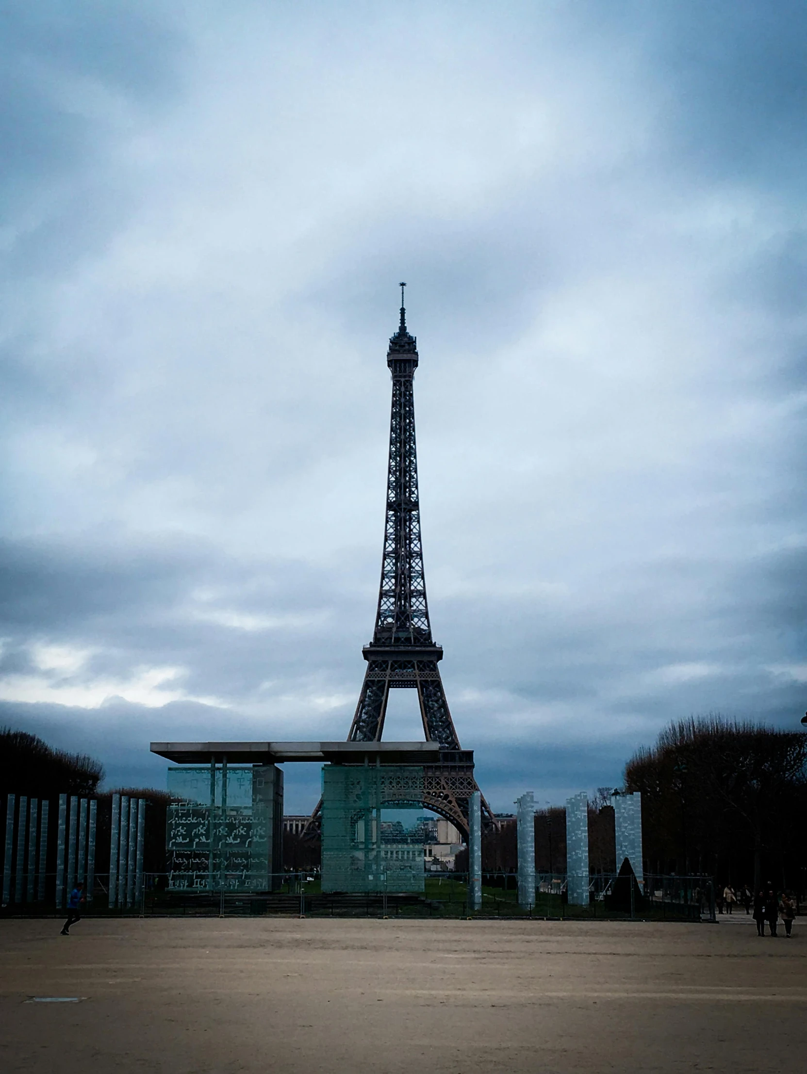 the eiffel tower in the sky is seen at dusk