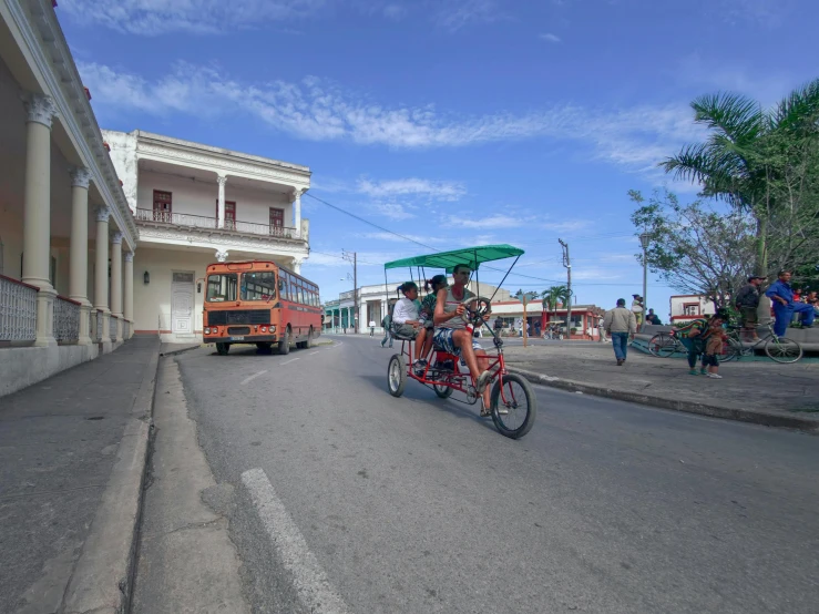 a person riding on the bike behind another cyclist