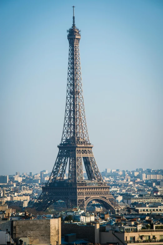 a very tall tower stands high above the city