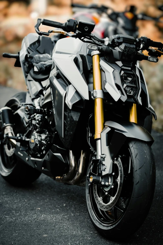 a silver motorcycle is sitting in the street