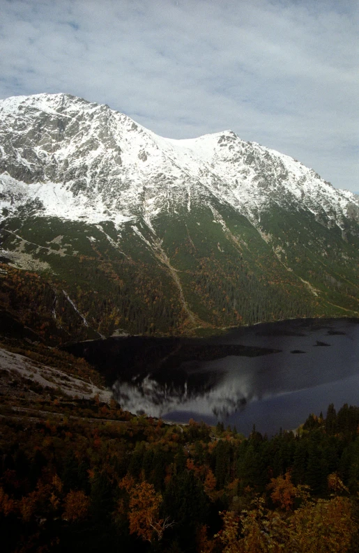 view of mountains with lake and trees in foreground