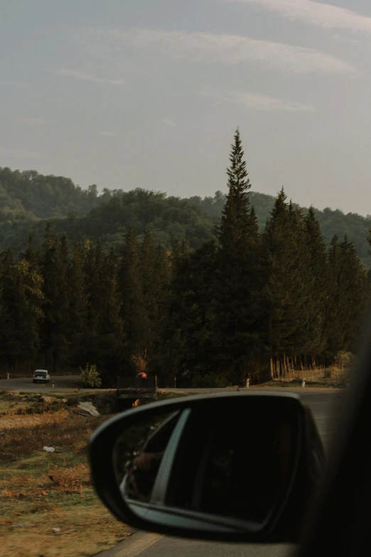 the back view mirror of a vehicle on the road