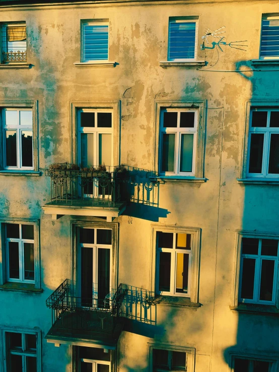 an old building with balconies and railings and windows