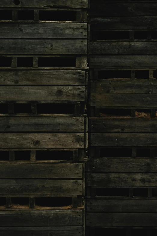 old brown wooden crates stacked against one another