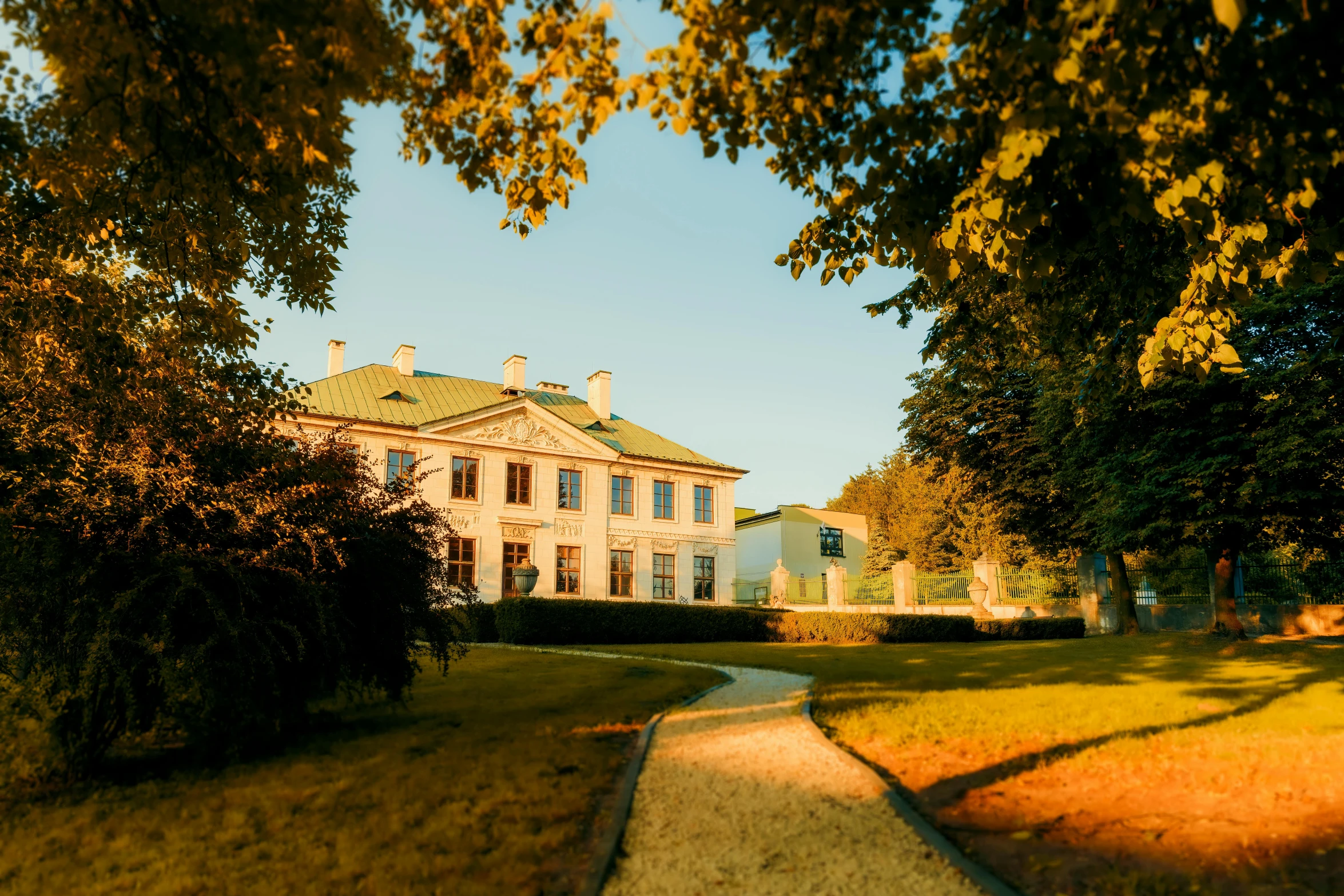 a house is surrounded by trees and grass