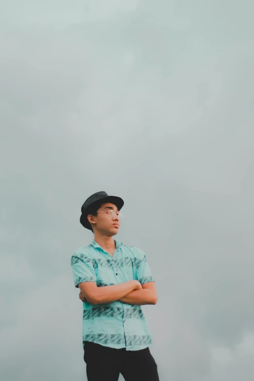 an asian man standing in front of the camera