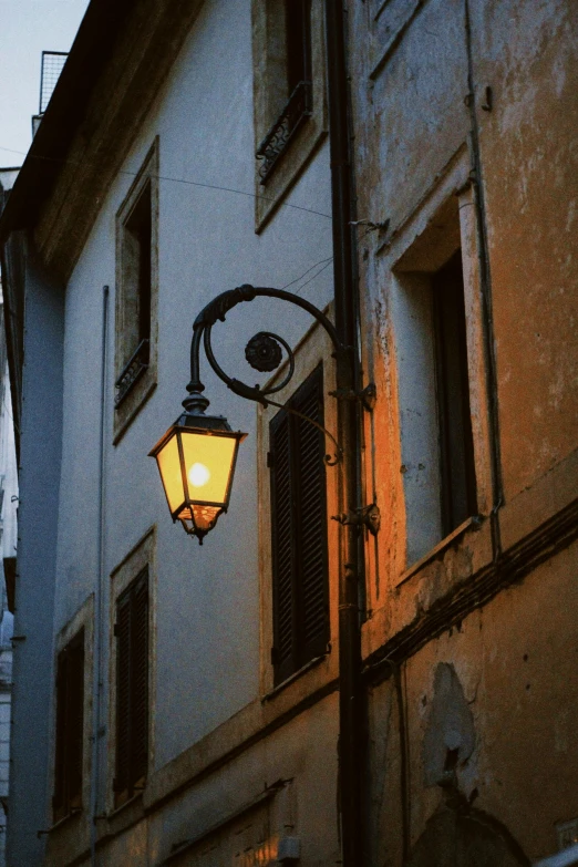 a lamp attached to the side of a building