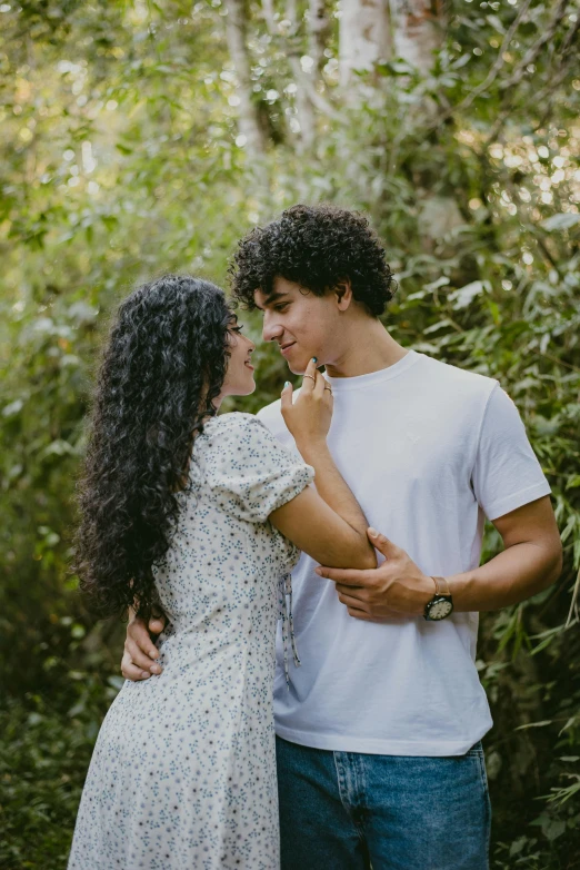 two people sharing a moment in the forest