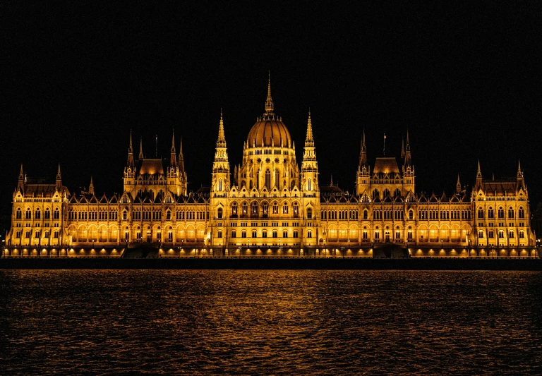 the castle is lit up in the night sky