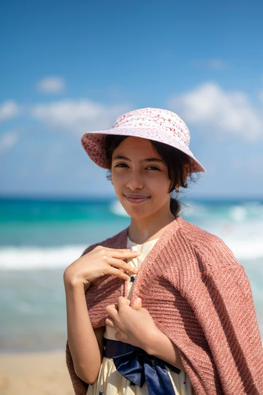 a woman on the beach is posing for a po